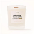 Bougie parfumée Les Fées Mères avec l'étiquette « Le Père Noël m'a dit que tu avais été sage », pot blanc et mèche en bois de hêtre