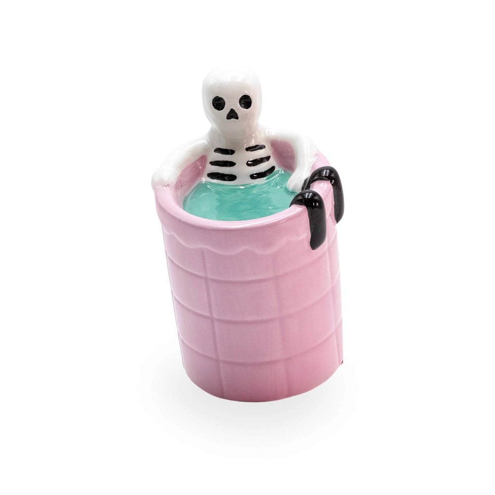 Brûle parfum squelette qui se baigne dans une piscine rose en céramique, déco d'Halloween, Les Fées Mères, vue de côté