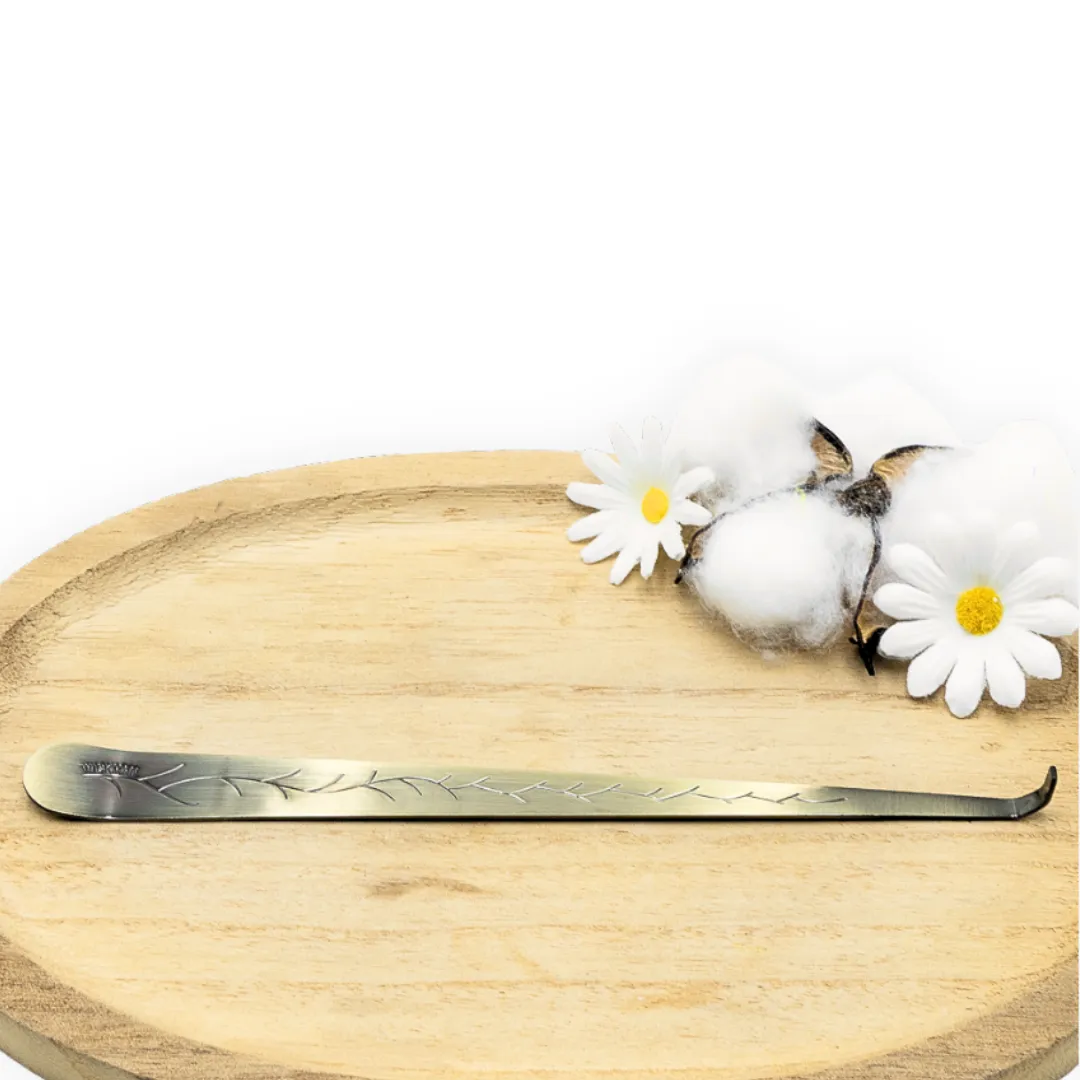 cette photo représente le pince mèche en laiton